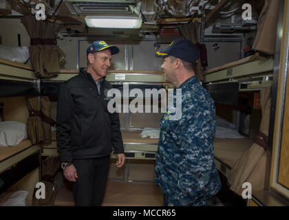 BANGOR, Wash. (Feb. 9, 2018) Cmdr. Jeffery Yackeren, commanding officer USS Alabama (SSBN 731), shows  Deputy Secretary of Defense Patrick Shanahan sailors living quarters onboard the boat.  Alabama is one of eight ballistic-missile submarines stationed at the base, providing the most survivable leg of the strategic deterrence triad for the United States. (U.S. Navy photo by Mass Communication Specialist 2nd Class Nancy C. diBenedetto/Released) Stock Photo