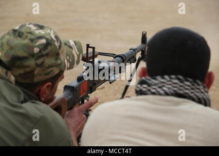 Iraqi soldiers fire the PKC machine gun during a live fire exercise of ...