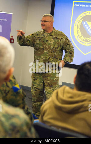 Command Sergeant Major Steven Shepherd, NATO Headquarters Sarajevo’s senior enlisted leader, facilitated a discussion about culture and diversity with Non-Commissioned Officer students at the Peace Support Operations Training Centre, Camp Butmir, Bosnia and Herzegovina,Feb. 12, 2018. The NCOs from multiple nations are attending the two-week Essential Staff Non-Commissioned Officers Skills Course. (U.S. Air Force photo by Staff Sgt. Amber Sorsek) Stock Photo