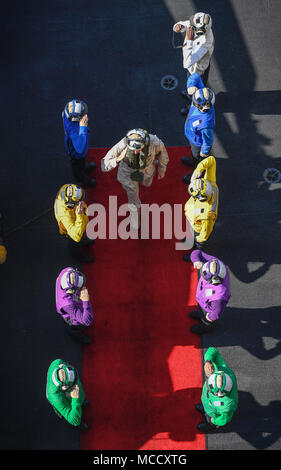 180212-N-MJ135-1018 ARABIAN GULF (Feb. 12, 2018) Lt. Gen. William Beydlar, Commander, Marine Corps Forces Central Command, salutes the sideboys on the flight deck of the aircraft carrier USS Theodore Roosevelt (CVN 71). Theodore Roosevelt and its carrier strike group are deployed to the U.S. 5th Fleet area of operations in support of maritime security operations to reassure allies and partners and preserve the freedom of navigation and the free flow of commerce in the region. (U.S. Navy photo by Mass Communication Specialist 3rd Class Spencer Roberts/Released) Stock Photo