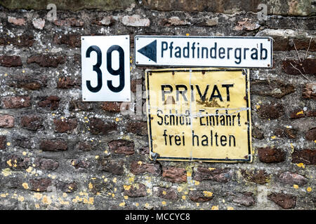 LIEDBERG / GERMANY - APRIL 14 2018: Sign showing the way to the pathfinder grave. Stock Photo