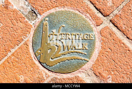 decorative metal sidewalk disc along Baltimore's Heritage Walk historical walking trail Stock Photo