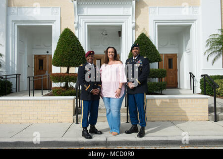 United States Special Operations Command oversees the nation’s special operations forces under the Department of Defense. On Feb. 13, 2018, two Army colonels assigned to USSOCOM posed with a community attendee following a speech to middle school students in Tampa, Florida, focused on commitment and resilience. The archival image documents the post-event interaction. Stock Photo