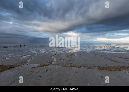 Dramatic clouds over the Swale estuary from Seasalter beach, Whitstable, Kent, UK. Stock Photo