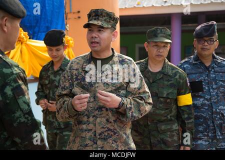 U.S. Navy Lt. Aroon Seeda speaks to the Royal Thai Army and Air Force, during Exercise Cobra Gold 2018 at Pong Ka Sang School in Nakhon Ratchasima, Kingdom of Thailand, Feb. 20, 2018. Chaplain Seeda was Born and raised in Pluak Daeng, Rayong province, Kingdom of Thailand as a Buddhist monk and immigrated to the United States in 2001 before joining the Navy Reserve in 2008. Humanitarian civic assistance projects conducted during the exercise support the needs and humanitarian interests of the Thai people. Cobra Gold 18 is an annual exercise conducted in the Kingdom of Thailand and runs from Feb Stock Photo