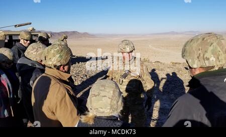 Maj. Gen. John Thomson III, deputy commanding general of operations, III Corps, welcomes members of the Killeen and Harker Heights Chambers of Commerce on a guided tour of the National Training Center, Fort Irwin, Calif., Feb. 18, 2018. The Killeen and Harker Heights Chambers of Commerce NTC visit is designed to strengthen relationships between civic leaders in the surrounding Fort Hood community and service members assigned to Fort Hood, Texas. (US Army photo by Maj. Anthony Clas, 7th Mobile Public Affairs Detachment) Stock Photo