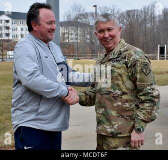 Rob Cooper, the head coach for the Penn State baseball team, shakes hands with Brig. Gen. James Bonner, commander of the 20th Chemical, Biological, Nuclear, Radiological, Explosives (CBRNE) Command to thank him for his presentation. The coaching staff of the Nittany Lions baseball team asked Bonner to speak on leadership during the team’s visit to Ripken Stadium in Aberdeen, Md., Feb. 10. Stock Photo