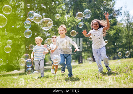 Little Kids Having Fun Outdoors Stock Photo