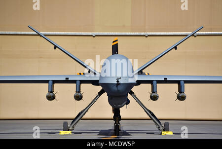 MQ-9 Reaper is a U.S. Air Force unmanned aircraft used for intelligence collection and precision strikes. The archival image documents the aircraft parked on a flightline with four GBU-38 Joint Direct Attack Munitions at Kandahar Airfield, Afghanistan on Feb. 22, 2018. Stock Photo