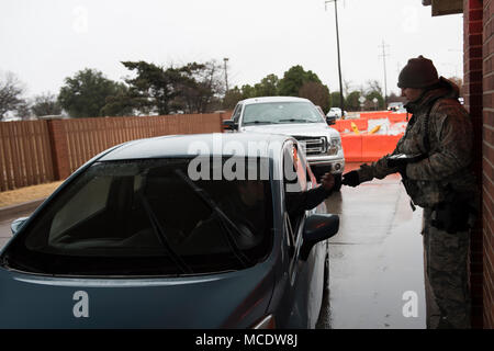 82nd Security Forces Squadron is a United States Air Force unit responsible for base security and law enforcement at Sheppard Air Force Base, Texas. An entry controller verifies identification at the installation’s main gate on Feb. 23, 2018, following a winter weather closure. The archival image documents security operations during the reopening of the base. Stock Photo