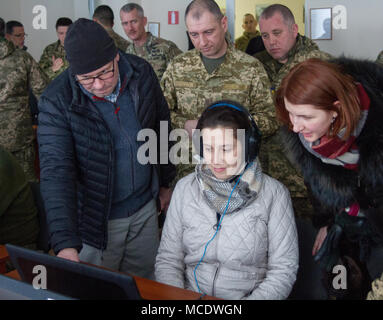 Yavoriv, Ukraine – U.S. Representative Elise Stefanik (R-NY) test a Joint Conflict and Tactical Simulation (JCATS) terminal during a visit to the Yavoriv Combat Training Center (CTC) here Feb. 23. During the visit Stefanik met with U. S. service members stationed at the CTC and observed training conducted by 27th Infantry Brigade Combat Team Soldiers in the field. (U.S. Army photo by Sgt. Alexander Rector) Stock Photo