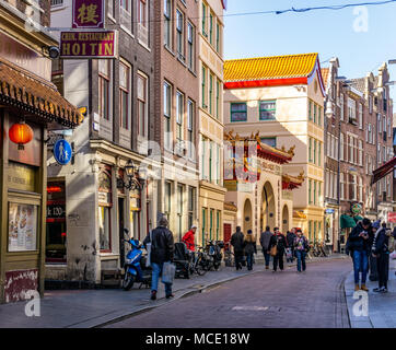 AMSTERDAM, NETHERLANDS - March 20, 2018 : narrow streets of chinatown in Amsterdam at sunny spring day. Stock Photo