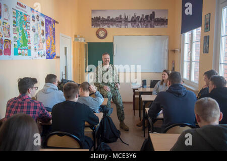 {180228-N-ST458-7262} NAVAL SUPPORT FACILITY REDZIKOWO, Poland (Feb. 28, 2018) Capt. Scott McClelland, commanding officer of Naval Support Facility (NSF) Redzikowo, speaks to Polish high school students about his experience in the Navy. Its operations enable the responsiveness of U.S. and allied forces in support of Navy Region Europe, Africa, Southwest Asia™s (NAVEURAFSWA) mission to provide services to the Fleet, Fighter, and Family. (U.S. Navy photo by Lt. Josie Lynne Lenny/Released) Stock Photo