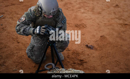 Staff Sgt. James Cason, aerial combat broadcaster, 1st Combat Camera Squadron, Joint Base Charleston, South Carolina, documents tactical drills Feb. 8, 2018, at McCrady Training Center, Eastover, South Carolina, during Scorpion Lens, an annual Ability to Survive and Operate training exercise mandated by Air Force Combat Camera job qualification standards. Held at the United States Army Training Center Fort Jackson, South Carolina, and the McCrady Training Center, Eastover, South Carolina, the exercise's purpose is to provide refresher training to combat camera personnel. Individuals are instru Stock Photo