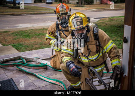 Maxwell AFB, Ala. – Fire and Emergency Services personnel simulate responding to a mass casualty situation during the base Major Accident Response exercise, Feb. 12, 2018. (Air Force photo by Donna L. Burnett/Released) Stock Photo