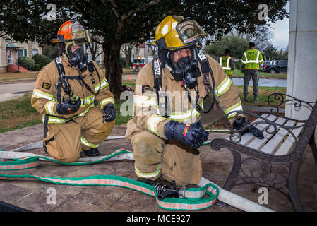 Maxwell AFB, Ala. – Fire and Emergency Services personnel simulate responding to a mass casualty situation during the base Major Accident Response exercise, Feb. 12, 2018. (Air Force photo by Donna L. Burnett/Released) Stock Photo