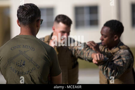 https://l450v.alamy.com/450v/mcea6r/us-marine-corps-cpl-matthew-palevoda-with-leads-his-first-marine-corps-martial-arts-program-session-on-april-10-2018-at-camp-schwab-okinawa-japan-mcmap-teaches-marines-the-fundamentals-of-hand-to-hand-combat-ground-fighting-and-self-defense-techniques-palevoda-a-native-of-west-palm-beach-florida-is-a-combat-engineer-with-combat-assault-battalion-us-marine-corps-photo-by-cpl-charles-plouffe-mcea6r.jpg