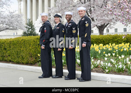 180411-N-YU482-049 WASHINGTON (April 11, 2018) From left, Navy Reserve Sailor of the Year finalists Master-at-Arms 1st Class Ian Barton, Legalman 1st Class Cynthia Hunter, Yeoman 1st Class Antonio Ross and Engineman 1st Class Brandon Lovell stand for a photo in front of the Supreme Court during a tour of Washington D.C. as part of a week-long ceremony to select the top Reserve Sailor and recognize each finalist for their exceptional performance. (U.S. Navy photo by Mass Communication Specialist Chief Stephen Hickok/Released) Stock Photo