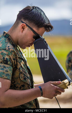 RQ-11B Raven is a small unmanned aircraft system operated via a portable ground control unit for intelligence, surveillance, and reconnaissance missions. The archival image documents operation of the hand controller during a Marine Corps Basic Operator Training Course at Camp Pendleton, California, on April 12, 2018. Stock Photo
