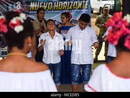 Children from a local school in Meteti, Panama, perform a dance for guests at the opening ceremony for Exercise New Horizons 2018, April 11, 2018. Representatives from the Ministry of Education, Ministry of Health, Ministry of Security, the government of Panama, the mayor of Meteti, and the commander of the 346th Air Expeditionary Group who the exercise falls under, Col. Darren Ewing, took part in the ceremony which was attended by about 150 community members. The joint-service exercise will provide deployment readiness training to U.S. military members, while also benefiting local communities Stock Photo