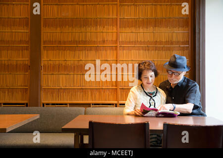 Senior couple reading books Stock Photo