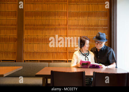 Senior couple reading books Stock Photo