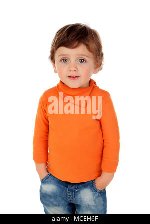 Beautiful little child two years old wearing jeans and orange jersey isolated on white background Stock Photo