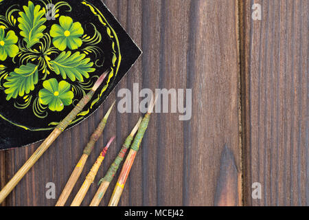 Old used small paint brushes on brushed metal texture background Stock  Photo - Alamy