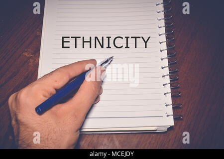 Ethnicity word written on white paper Stock Photo