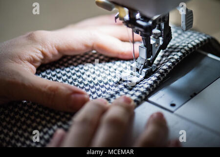 Young woman using sewing machine, startup business. Stock Photo