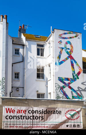 Mural street art on side of building to be demolished for development at Robert Street, North Laine area, Brighton, East Sussex, England UK in April Stock Photo