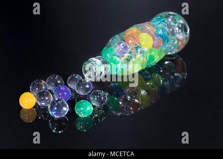Bottle with spread hydrogel balls Stock Photo