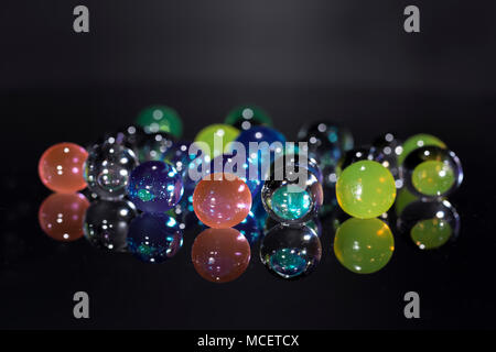 Hydrogel colored balls on black background Stock Photo