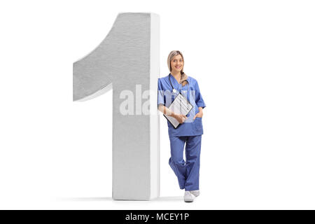 Full length portrait of a female doctor leaning against a number one figure isolated on white background Stock Photo