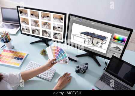 High Angle View Of A Female Designer Working On Color Selection For House Stock Photo