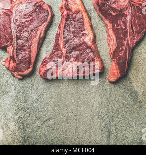 Flat-lay of fresh raw beef meat steaks, square crop Stock Photo