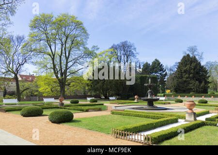 The beautiful decorative garden with many trees shortly after sunrise, spring sunny day. The Royal Garden at Prague Castle was built by Emperor Ferdin Stock Photo