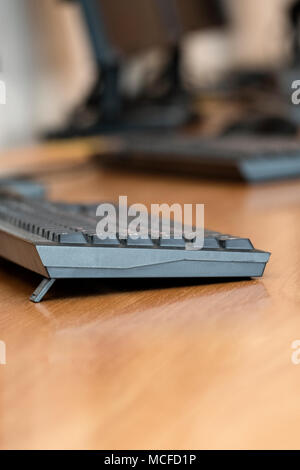 Image of computer keyboards on the table in line, shallow depth of field Stock Photo