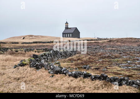 On the Reykjanes peninsula, Iceland. Hvalsnes church, (Hvalsneskirkja), Sandgerði, built in 1887 of black basalt stone Stock Photo