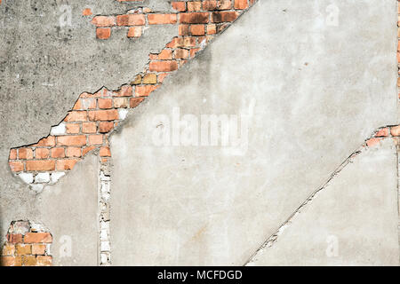 Old plastered wall with red bricks Stock Photo