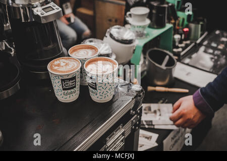 Latte art in filled cups at the London Coffee Festival – April 2018 Stock Photo