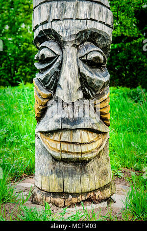 Wooden carving face on  totem pole, Indian Museum, Poland.