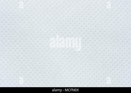 White perforated paper texture background. Dotted white panel surface Stock Photo