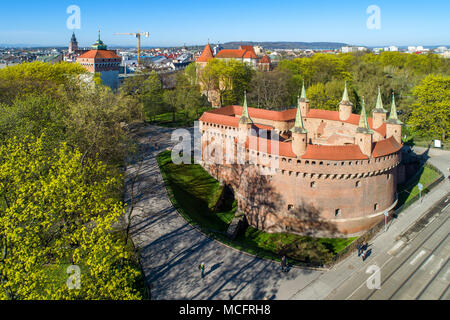 Barbican (Barbakan) in Cracow, Poland. The best preserved medieval barbican in Europe and Planty park surrounding the old city. Aerial view Stock Photo