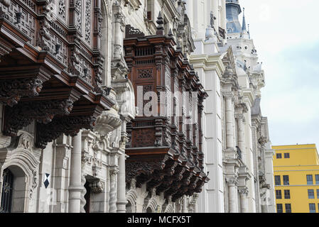 Colonial balcony in downtown Lima, Peru. Popular tourist attraction in Plaza de armas. Stock Photo
