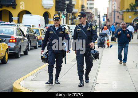 Lima / Peru - 07.18.2017: Police patrol on duty walking by the Presidential palace. Stock Photo