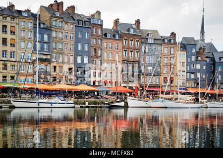 Honfleur is a city in the department of Calvados, in northern France's Normandy region. It's on the estuary where the Seine river meets the Channel. Stock Photo