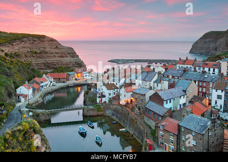 View over fishing village on east coast at sunrise, Staithes, North Yorkshire, England, United Kingdom, Europe Stock Photo