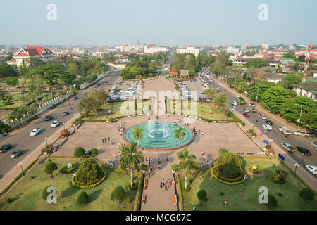 View of people at the Patuxai Park and beyond from the top of the Patuxai (Victory Gate or Gate of Triumph) war monument in Vientiane, Laos. Stock Photo