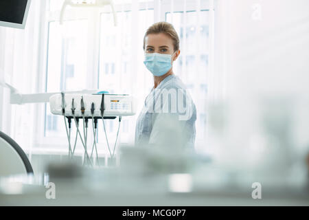 Skilled dentist waiting for her patient Stock Photo